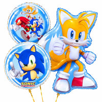 Sonic Tails Trosje – heliumgevulde ballonnen met dunne gouden lintjes op een witte achtergrond
